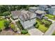 Aerial view of the home showcasing a two-car garage, driveway, and landscaped surroundings at 1342 Briar Chapel Pkwy, Chapel Hill, NC 27516