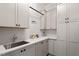 Well-equipped laundry room features lots of counter space and cabinet storage at 1342 Briar Chapel Pkwy, Chapel Hill, NC 27516