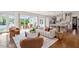 Inviting living room featuring hardwood floors, sliding glass doors to a patio, and a comfortable seating arrangement at 1342 Briar Chapel Pkwy, Chapel Hill, NC 27516