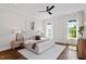 Serene main bedroom featuring large windows, a ceiling fan and hardwood floors at 1342 Briar Chapel Pkwy, Chapel Hill, NC 27516