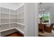 Walk-in pantry with ample shelving and storage space, conveniently located near the dining area at 1342 Briar Chapel Pkwy, Chapel Hill, NC 27516