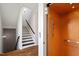 Modern staircase with black treads and an elevator for easy access between floors at 1342 Briar Chapel Pkwy, Chapel Hill, NC 27516