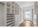 Large walk-in closet with custom shelving, drawers, and organization systems at 1342 Briar Chapel Pkwy, Chapel Hill, NC 27516