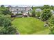 Expansive lawn area surrounded by lush landscaping and mature trees creates a private oasis at 1342 Briar Chapel Pkwy, Chapel Hill, NC 27516