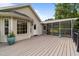 Wide deck with siding and easy access to the screened-in porch at 1383 Deercroft Ct, Graham, NC 27253