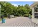 Spacious backyard deck with view of lush greenery at 1383 Deercroft Ct, Graham, NC 27253