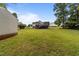 Expansive backyard featuring a large deck perfect for outdoor entertaining at 1383 Deercroft Ct, Graham, NC 27253