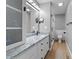 Bathroom with a double sink, granite countertops, and a tile shower at 1383 Deercroft Ct, Graham, NC 27253