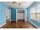Bedroom with laminate flooring, ceiling fan, and closet at 1383 Deercroft Ct, Graham, NC 27253