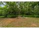 Scenic wooded creek with a small bridge offers a tranquil natural setting at 1383 Deercroft Ct, Graham, NC 27253