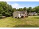 Well-maintained home with mature landscaping and vinyl siding at 1383 Deercroft Ct, Graham, NC 27253