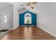 Bright living room featuring vaulted ceilings, wood floors, and large arched window at 1383 Deercroft Ct, Graham, NC 27253