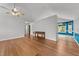 Hardwood floors, neutral walls, and view of the dining area in this home's living space at 1383 Deercroft Ct, Graham, NC 27253