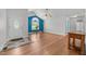 Open living space with hardwood floors, vaulted ceilings, and large windows at 1383 Deercroft Ct, Graham, NC 27253