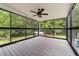 Screened-in porch with ceiling fan offers a relaxing outdoor space at 1383 Deercroft Ct, Graham, NC 27253