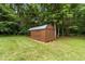 Brown storage shed for convenient outdoor storage at 1383 Deercroft Ct, Graham, NC 27253