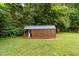 Backyard shed with porch and double doors for easy access at 1383 Deercroft Ct, Graham, NC 27253