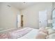 Comfortable bedroom with plush pillows, a soft throw, and neutral paint at 142 College Ave Ave, Durham, NC 27713