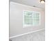Bright bedroom with a large window and neutral carpet at 142 College Ave Ave, Durham, NC 27713