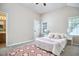 Cozy bedroom featuring soft carpet, natural light, and stylish décor at 142 College Ave Ave, Durham, NC 27713