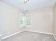 Spacious bedroom with great natural light and neutral carpet at 142 College Ave Ave, Durham, NC 27713