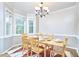 Bright dining room with natural light, neutral tones, and a classic chandelier for elegant meals at 142 College Ave Ave, Durham, NC 27713