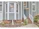 Close-up of the front entrance featuring a welcoming door, brick steps, and manicured landscaping at 142 College Ave Ave, Durham, NC 27713