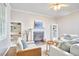 Comfortable living room boasts a fireplace, built-in bookshelves, and plenty of seating at 142 College Ave Ave, Durham, NC 27713