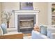 Living room with fireplace, comfortable seating, and a neutral color palette at 142 College Ave Ave, Durham, NC 27713