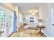 Open-concept living space featuring hardwood floors, a fireplace, and access to outdoor living at 142 College Ave Ave, Durham, NC 27713