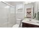 Bathroom with glass enclosed shower, single vanity and neutral finishes at 143 Thornbury St, Clayton, NC 27527