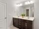 Bathroom featuring a double vanity, large mirror, and ample cabinet space at 143 Thornbury St, Clayton, NC 27527