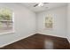 Bedroom with hardwood floors and large windows offering natural light at 143 Thornbury St, Clayton, NC 27527