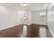 Spacious bedroom with hardwood floors, natural light, and a door leading to outdoor space at 143 Thornbury St, Clayton, NC 27527