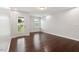 Bedroom with hardwood floors, natural light, and a door leading to outdoor space at 143 Thornbury St, Clayton, NC 27527