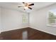 Bedroom featuring hardwood floors and large windows offering view at 143 Thornbury St, Clayton, NC 27527