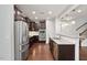 Kitchen features stainless steel appliances, granite countertops, and dark cabinets at 143 Thornbury St, Clayton, NC 27527
