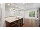 Kitchen with granite countertops, stainless appliances, and an open layout to the living area at 143 Thornbury St, Clayton, NC 27527