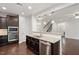 Modern kitchen features stainless appliances, granite counters, and dark cabinets at 143 Thornbury St, Clayton, NC 27527