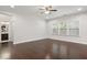 Spacious living room with hardwood floors, natural light, and ceiling fan at 143 Thornbury St, Clayton, NC 27527