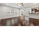 Open living area features hardwood floors, natural light, and access to the kitchen at 143 Thornbury St, Clayton, NC 27527