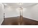 Spacious living room with hardwood floors and modern lighting fixtures throughout the house at 143 Thornbury St, Clayton, NC 27527