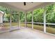 Inviting screened porch offering a relaxing view of the backyard at 143 Thornbury St, Clayton, NC 27527
