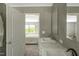 Bathroom with double sinks, marble countertops and a view into the bedroom at 150 Will Woods Way, Franklinton, NC 27525