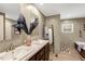 Bathroom boasting dual sinks, modern fixtures, a soaking tub, and stylish decor at 150 Will Woods Way, Franklinton, NC 27525