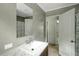 Bathroom showcasing marble countertop vanity, mirror, and modern fixtures at 150 Will Woods Way, Franklinton, NC 27525