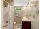 Bathroom featuring a shower, toilet, vanity, and decorative wall art at 150 Will Woods Way, Franklinton, NC 27525