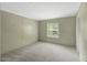 Spacious bedroom featuring neutral carpet and a window for natural light at 150 Will Woods Way, Franklinton, NC 27525