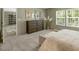 Spacious bedroom with soft carpet, dresser, and sunlit windows creating a cozy atmosphere at 150 Will Woods Way, Franklinton, NC 27525
