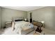 Bedroom featuring two bright windows and neutral tones offer a calm and inviting space at 150 Will Woods Way, Franklinton, NC 27525